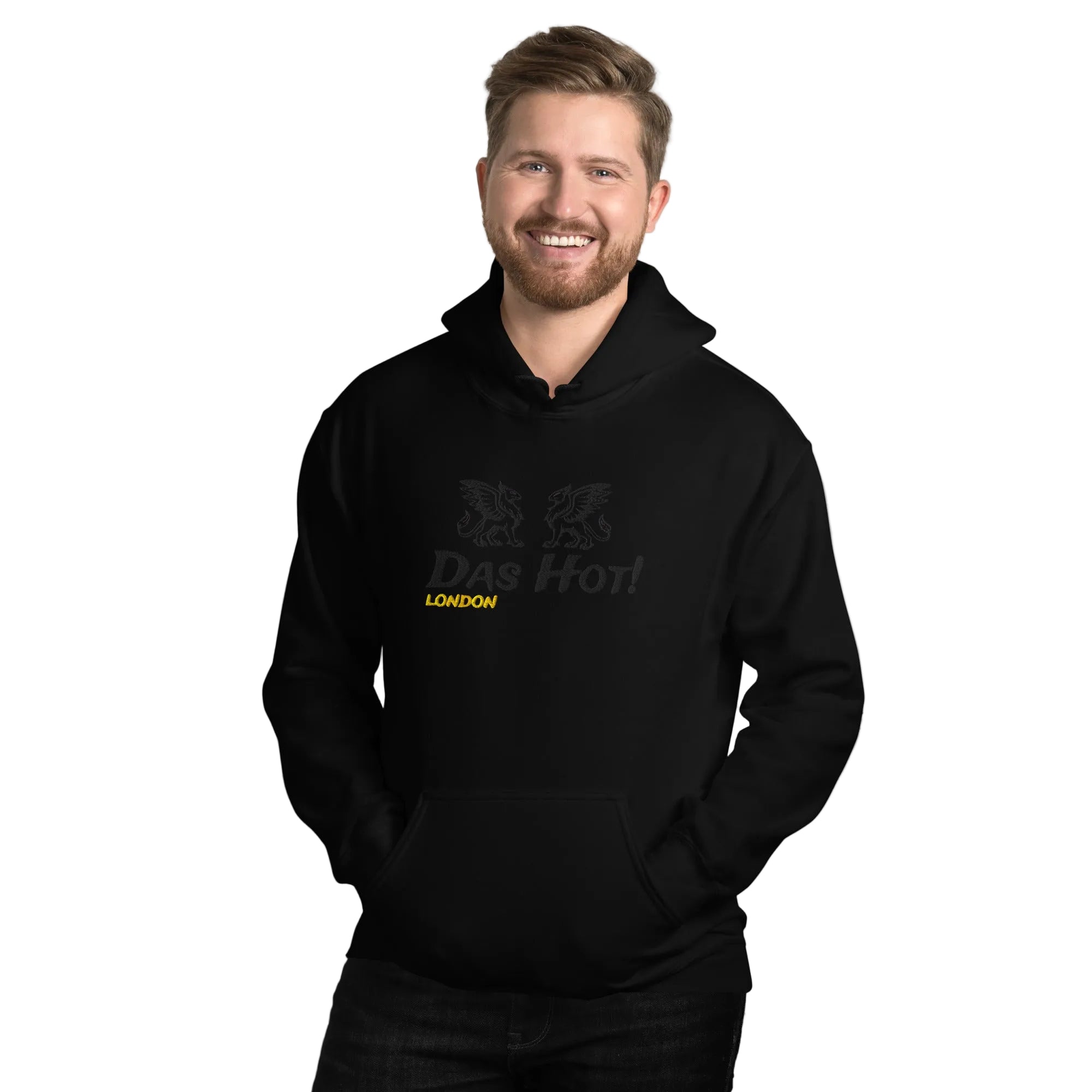 ALT TEXT:
Front view close up of a model wearing a premium black unisex streetwear hoodie by Das Hot! London featuring high density black-on-black raised embroidery of twin heraldic griffins and Das Hot! brand name on the chest with a contrasting yellow-gold embroidered London accent under the Das Hot! brand name.