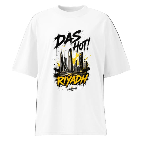 Front view of the Das Hot! Riyadh Skyline oversized organic streetwear t-shirt in white featuring black graffiti typography with a mustard gold Riyadh skyline graphic from the Desert Hype Collection.
