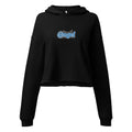 A ghost mannequin front view of the black Dashot cropped hoodie, highlighting the custom high-density "@ngel" (Angel) typography embroidery on the chest. The vibrant light blue and white stitching pops against the midnight black fleece with the intense clarity of a sweet turquoise drink. The signature "at" sign is prominently displayed, leading into the raw-edge cropped hem and relaxed, extended sleeves.