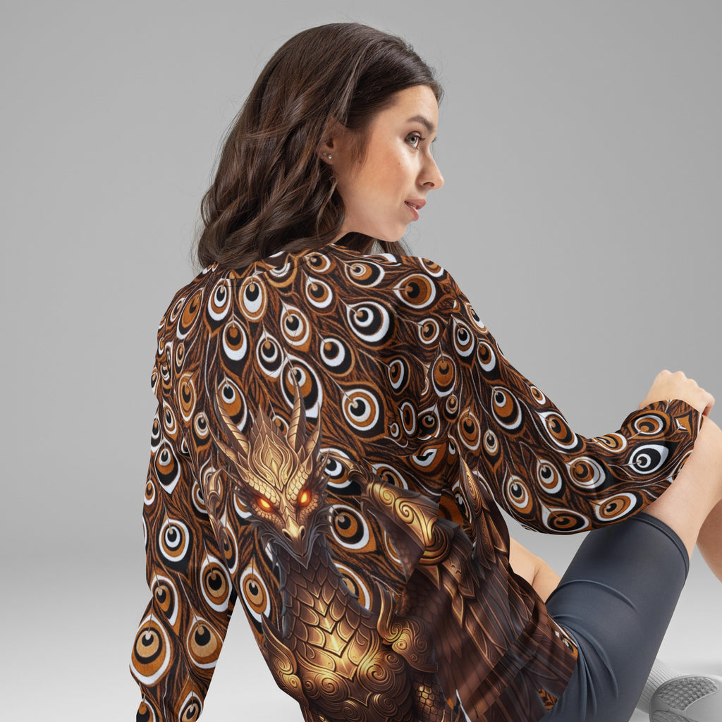 Back view of a female model wearing a long-sleeve sweatshirt with a metallic gold dragon design and a dark brown and black peacock feather print.