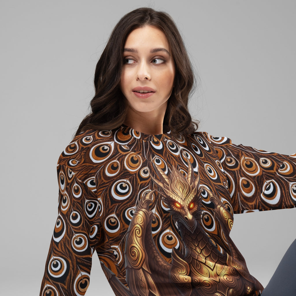 Female model wearing the Dragon Thousand Eyes unisex long-sleeve crewneck, featuring a metallic gold dragon design over a dark brown and black peacock feather print.
