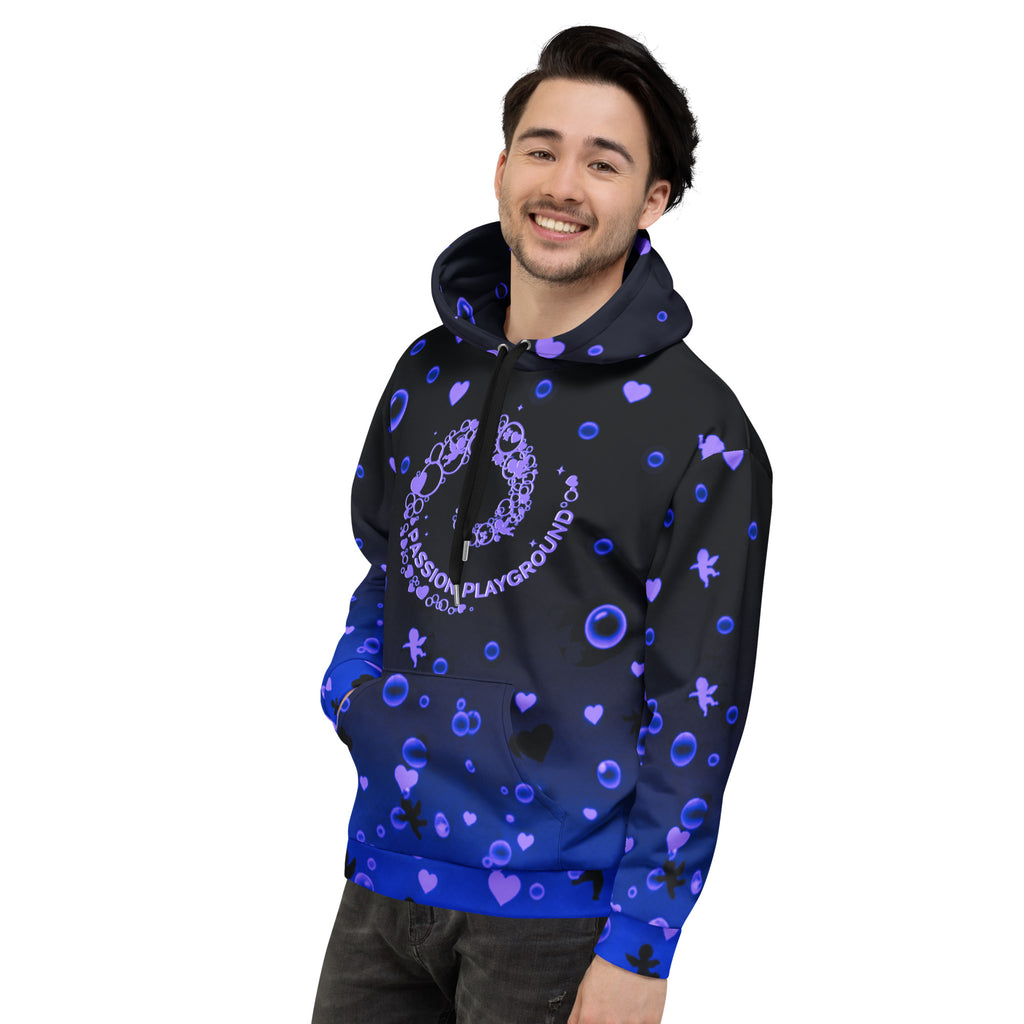 A smiling man wears a unisex Passion Playground streetwear hoodie in a left-angle front view, featuring a bubble swirl graphic on a black-to-blue gradient.