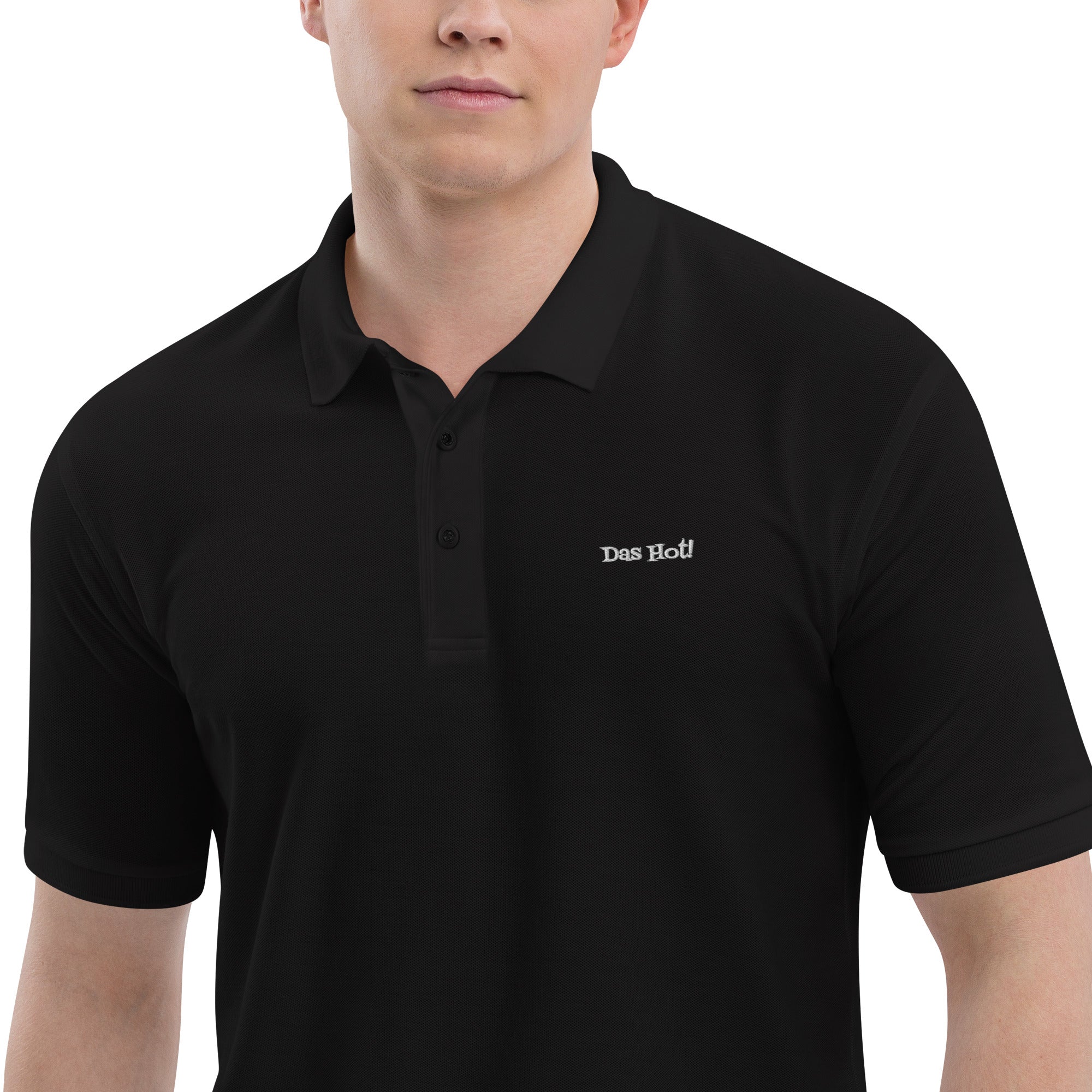 Black polo shirt with 'Das Boot!' logo worn by a person on a white background