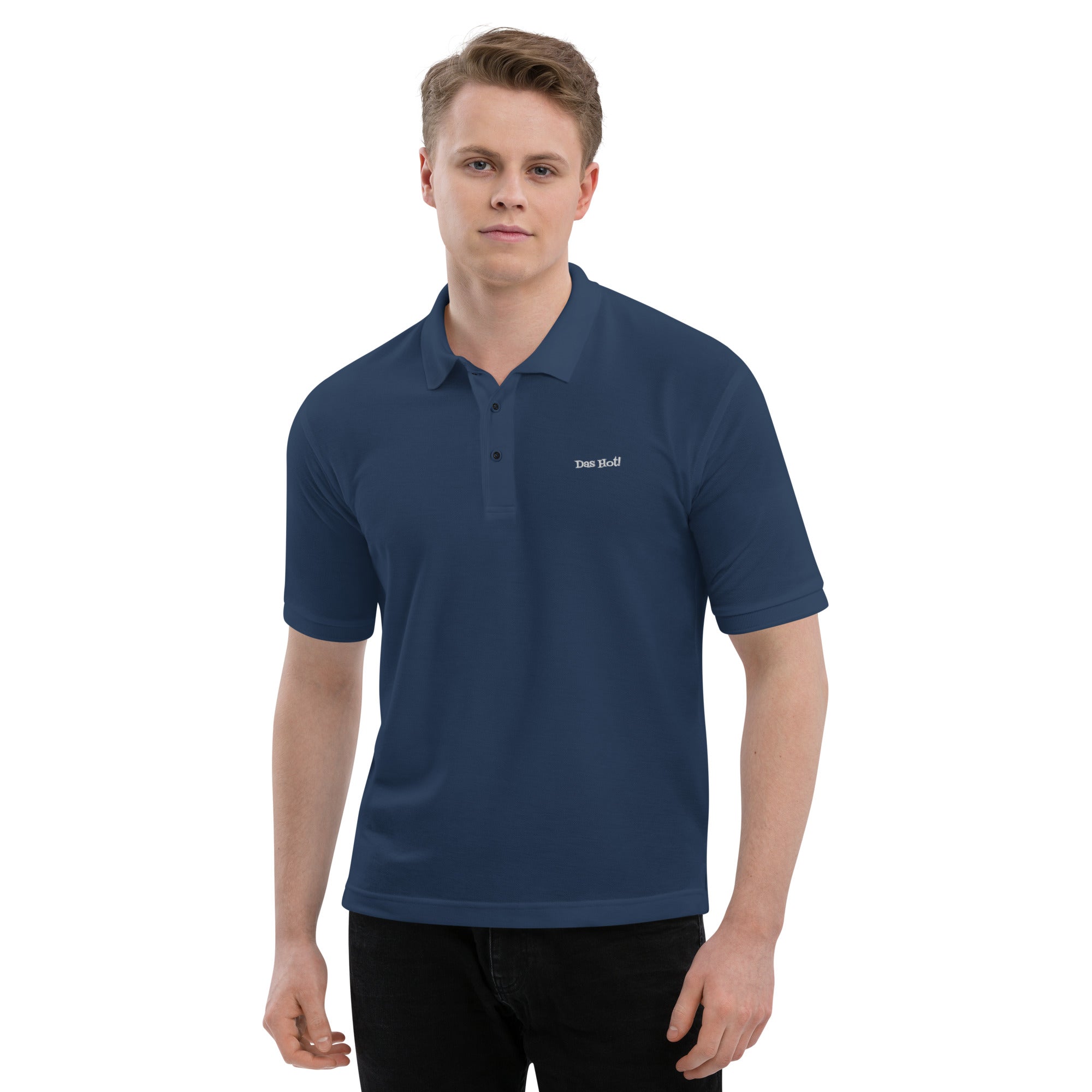 Man wearing a navy blue polo shirt with a logo on a white background