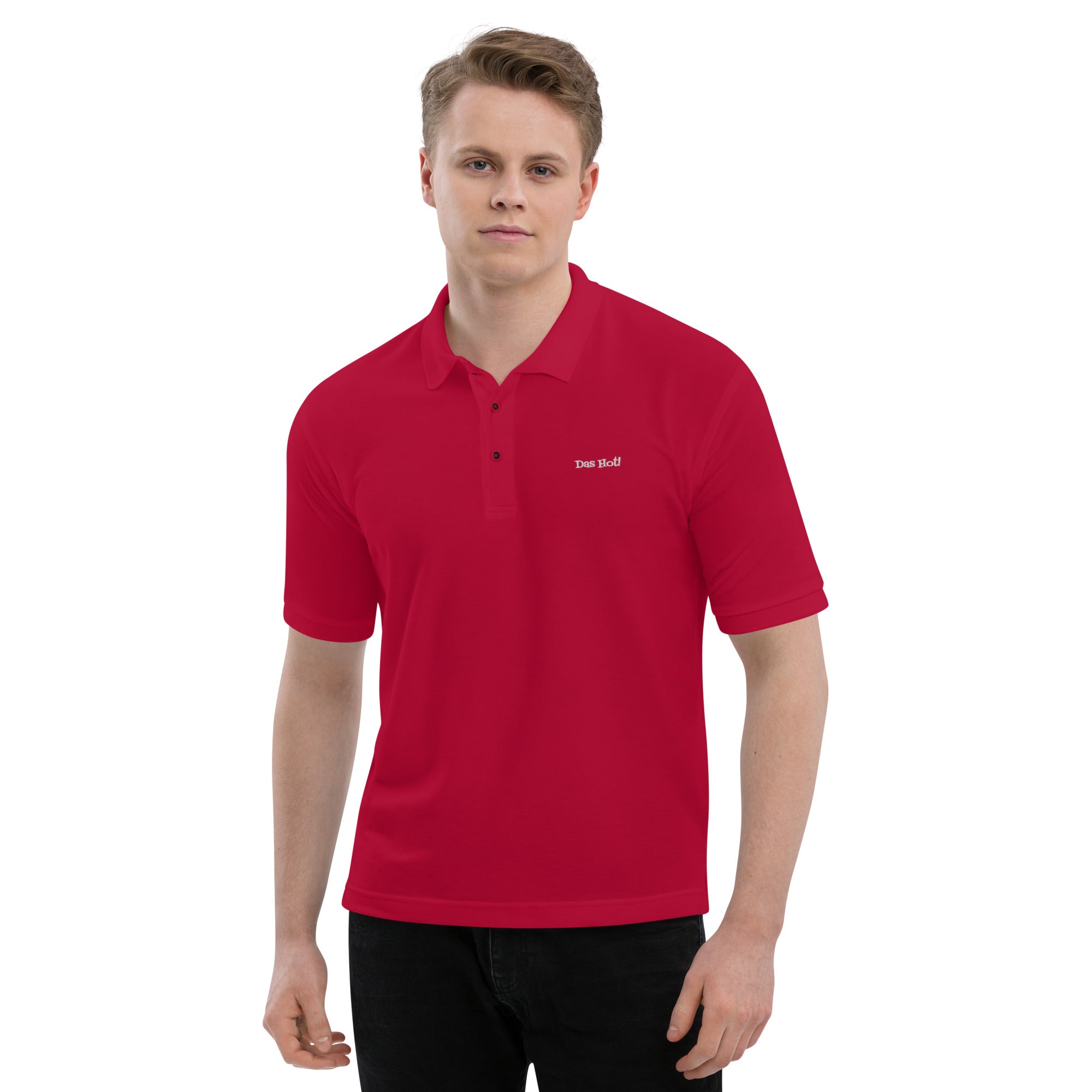Person wearing a red polo shirt with a logo on a white background